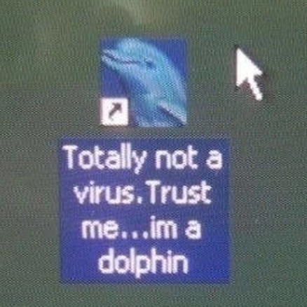 The meme "Totally not a virus.Trust me...im a dolphin". The source/copyright are unknown.